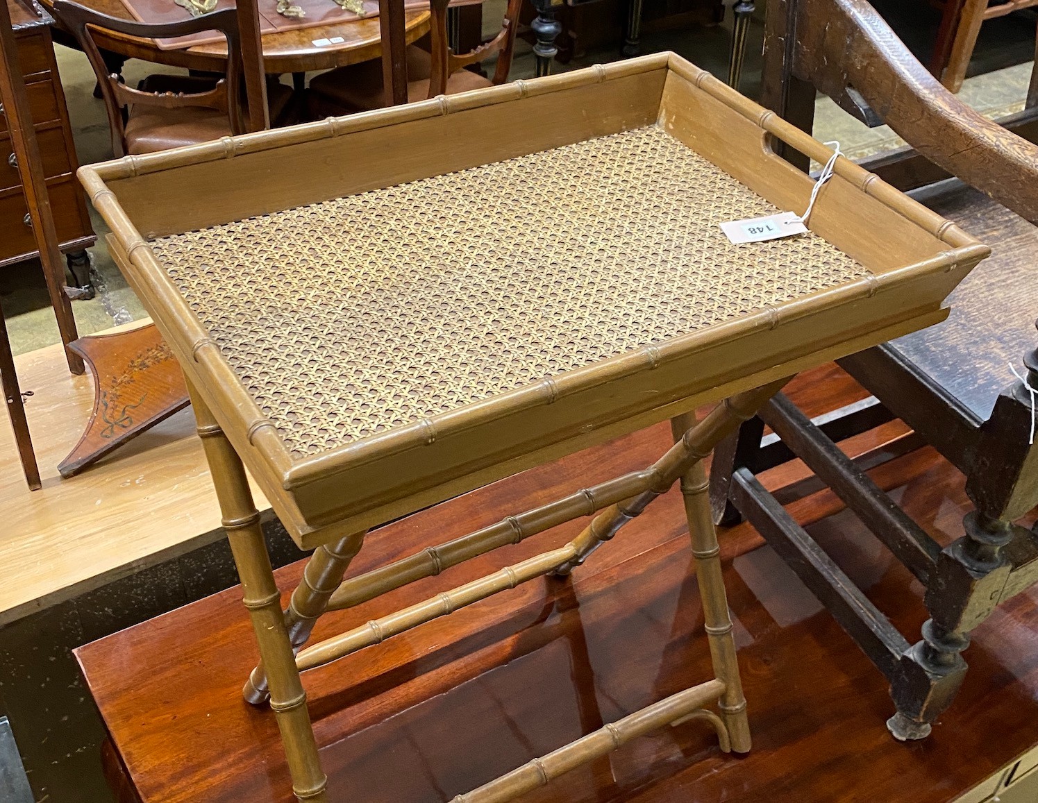 A faux bamboo caned butler's tray on folding stand, width 60cm, depth 43cm, height 68cm